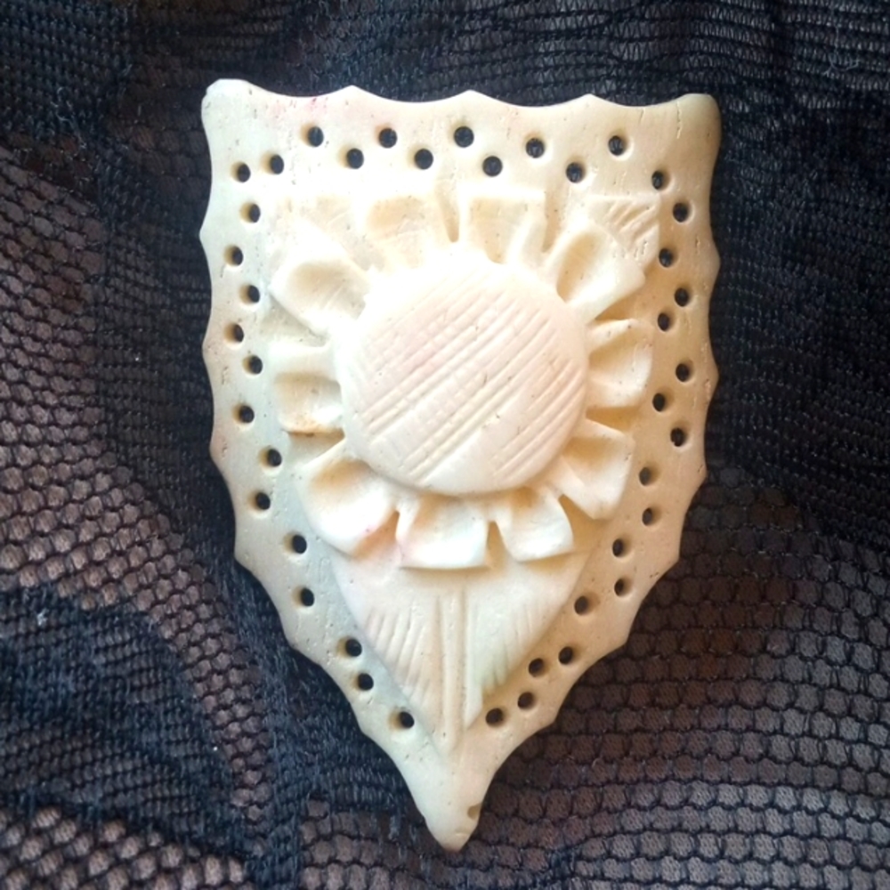 SOLID CARVED FLOWER PENDANT. FLAWLESS. SCULPTED HARD BOVINE.